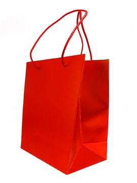 Shiny red shopping / gift bag isolated on white background