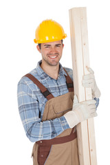 Worker wearing hard hat and holding timber