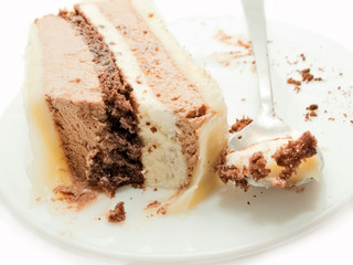 slice of chocolat mousse cake on white plate closeup