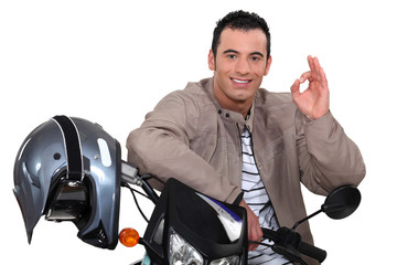 man on his motorbike making an okay sign