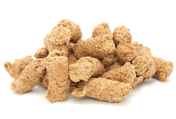 Pile of Extruded Bran Isolated on White Background