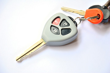 Car key with remote buttons on white background