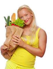 Portrait of smiling woman poing in studio with food