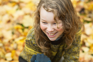 Fototapeta premium Outdoor high angle portrait of smiling blond girl