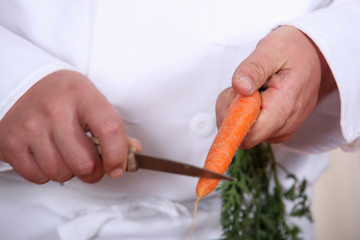Chef cutting a carrot