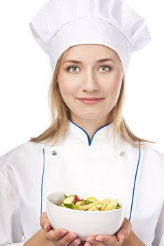 Young chef has prepared a healthy salad