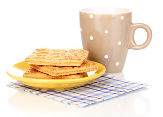 Cup of tea and cookies isolated on white