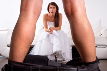 Bride shocked at the groom striptease - obrazy, fototapety, plakaty