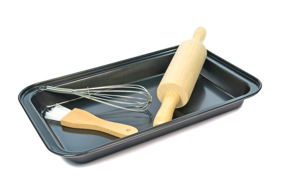 Baking Utensils In A Baking Tray On A White Background