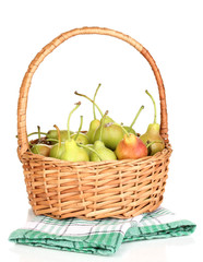 ripe pears in basket isolated on white.