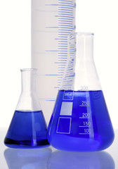 Three flasks with blue fluid