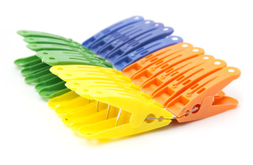 colored clothespins on white background
