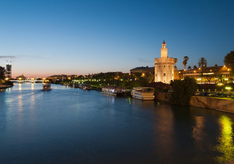 view of river Guadalquivir in Seville with Golden Tower (Torre d - 44364908