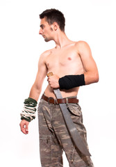 Young fighter holding a machete