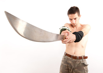 Young fighter holding a machete