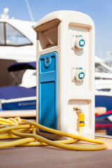 Water supply and waste container for boats standing at dock