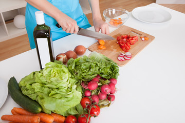 Cheerful young woman cooking