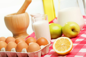 Fototapeta premium Milk in a glass jar and eggs