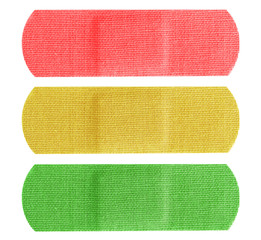 Red yellow and green bandaids