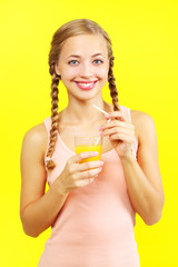 Teenager girl drinking orange juice