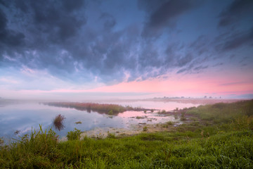 lake in fog at sunrise