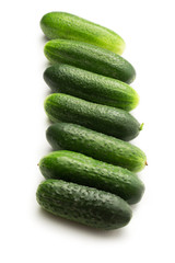 Fresh green cucumbers on white