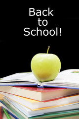 Green apple with book for school