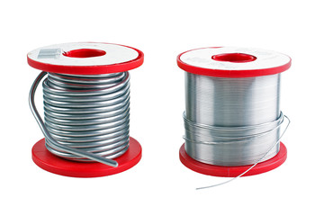 Two different size soldering tin spools - obrazy, fototapety, plakaty