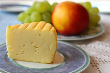 A segment of Mondseer Cheese (red-washed hay milk cheese)