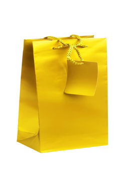 Golden gift shopping bag isolated on white