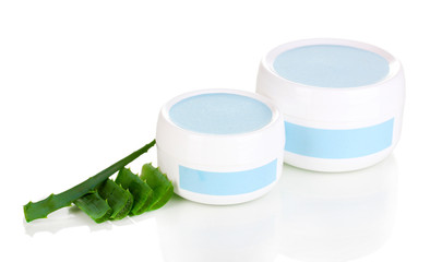 Jars of cream with aloe vera isolated on white