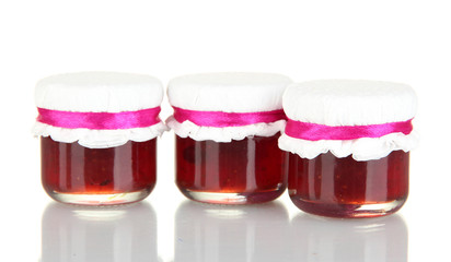 Jars with tasty jam isolated on white
