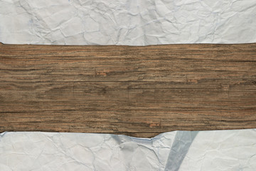 Old crumpled papers on wood