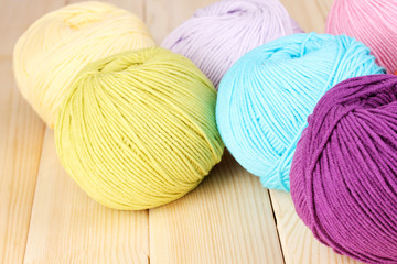 Knitting yarn on wooden background
