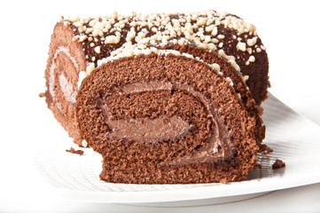 Swiss Sponge Roll With Cream on White Plate