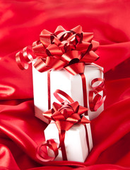 white gift box with a red background
