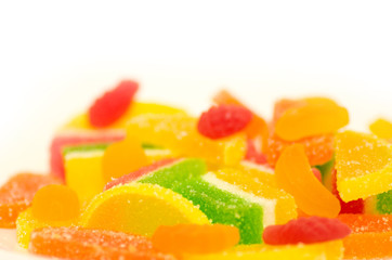 Tasty colorful jelly candies on a white background