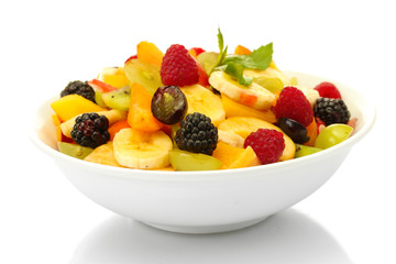fresh fruits salad in bowl, isolated on white