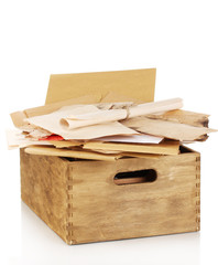 Wooden crate with papers and letters isolated on white