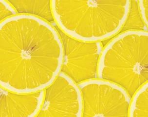 Fotobehang Abstracte achtergrond met citrusvruchten van schijfjes citroen. Detailopname. © oly5