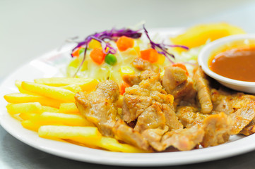 Grilled steak, French fries and vegetables,Salad