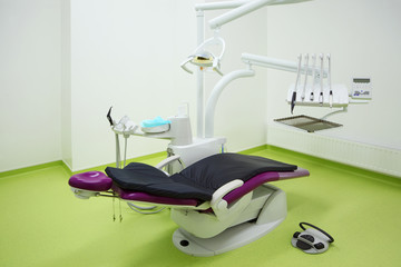 Empty dental clinic. Big and comfortable chair for patient