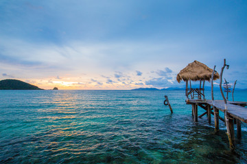 Cottage by the sea at sunset
