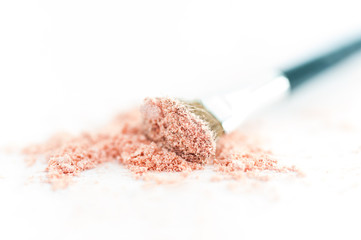 close up of a make up powder on white background