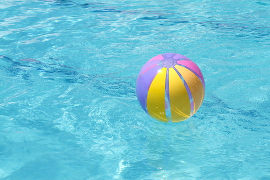 Beachball and swimmingpool. vacation