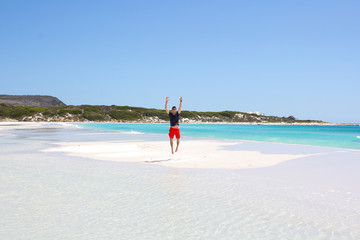 Man jumpin on small island