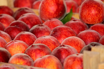 Fresh ripe peaches in the box
