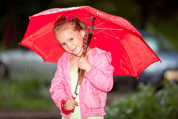 Little girl under an umbrella