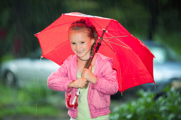 Little girl under an umbrella