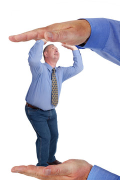 Man is under pressure between two hands